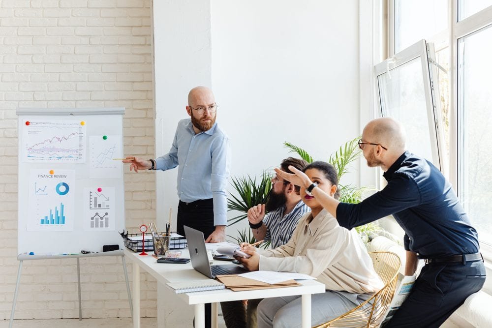 A small team reviewing their new site together