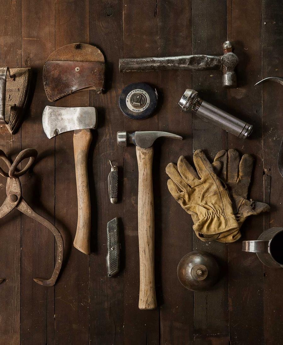 Hand tools hung on a workshop wall