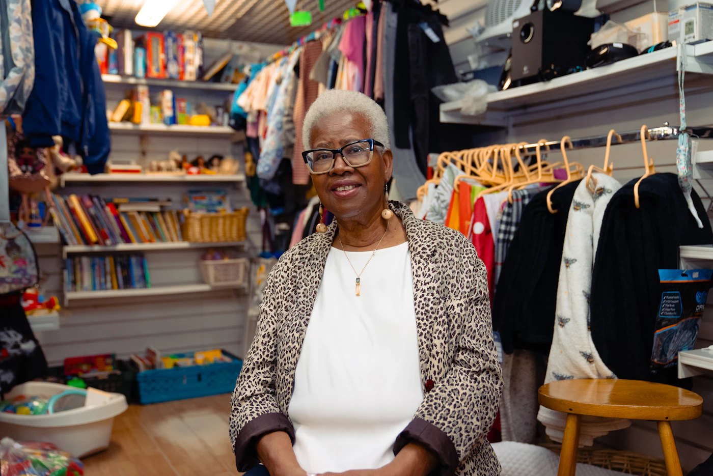 A shop owner standing in her store